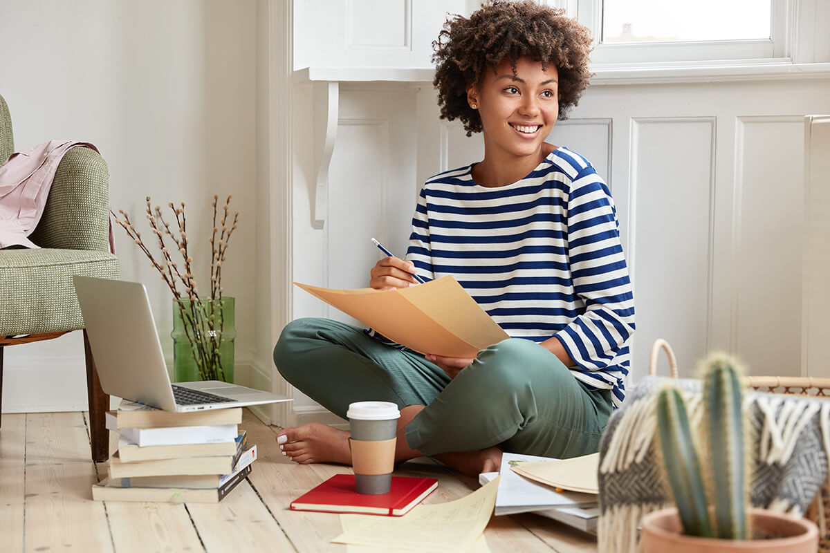 positive-freelancer-with-dark-skin-toothy-smile-ACXJ2GZ.jpg